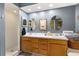 Double vanity bathroom with shower and updated wood cabinets at 10823 Indian Hills Ct # 32, Seminole, FL 33777