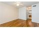 Bright bedroom with hardwood floors and ceiling fan at 10823 Indian Hills Ct # 32, Seminole, FL 33777