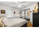 Bright bedroom with mirrored closet doors and wood floors at 10823 Indian Hills Ct # 32, Seminole, FL 33777