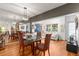 Open dining area with glass table and hardwood floors at 10823 Indian Hills Ct # 32, Seminole, FL 33777