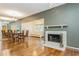 Bright dining room with hardwood floors, chandelier, and view into living room at 10823 Indian Hills Ct # 32, Seminole, FL 33777