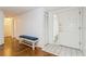Entryway with hardwood floors and built-in bench at 10823 Indian Hills Ct # 32, Seminole, FL 33777
