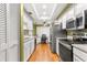 Modern kitchen with stainless steel appliances and granite countertops at 10823 Indian Hills Ct # 32, Seminole, FL 33777