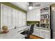 Spacious kitchen with granite countertops and built-in workspace at 10823 Indian Hills Ct # 32, Seminole, FL 33777