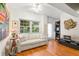 Cozy living area with hardwood floors and a comfy sofa at 10823 Indian Hills Ct # 32, Seminole, FL 33777