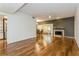 Spacious living room with hardwood floors and fireplace at 10823 Indian Hills Ct # 32, Seminole, FL 33777
