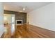 Living room with hardwood floors, fireplace and ceiling fan at 10823 Indian Hills Ct # 32, Seminole, FL 33777