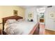 Large main bedroom with wood furniture and en-suite bathroom at 10823 Indian Hills Ct # 32, Seminole, FL 33777