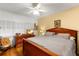 Bright main bedroom with hardwood floors and ample closet space at 10823 Indian Hills Ct # 32, Seminole, FL 33777