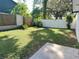Private backyard with grassy area and wooden fence at 701 S Oakwood Ave, Brandon, FL 33511