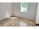 Bedroom with tile floors and a window providing natural light at 701 S Oakwood Ave, Brandon, FL 33511