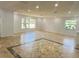 Large living area with tile floors and ample natural light at 701 S Oakwood Ave, Brandon, FL 33511