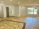 Spacious living area with tile floors and lots of natural light at 701 S Oakwood Ave, Brandon, FL 33511