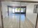 Bright sunroom with tile floors and screened windows at 701 S Oakwood Ave, Brandon, FL 33511