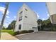 Modern three-story home with attached garage and landscaping at 310 N Oregon Ave, Tampa, FL 33606