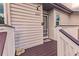 Inviting house entrance with a brown doormat, storm door, and small deck at 3507 59Th W Ave # 4020, Bradenton, FL 34210