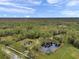 Property with two ponds and lush green landscape at 655 Appaloosa Rd, Tarpon Springs, FL 34688