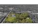 Aerial view of property showing home, pond, barn, and expansive land at 655 Appaloosa Rd, Tarpon Springs, FL 34688