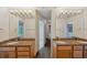 Double vanity bathroom with granite countertops at 655 Appaloosa Rd, Tarpon Springs, FL 34688