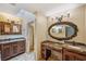 Primary bathroom with granite countertops and ornate mirror at 655 Appaloosa Rd, Tarpon Springs, FL 34688