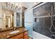 Bathroom with granite vanity and tiled shower/tub at 655 Appaloosa Rd, Tarpon Springs, FL 34688