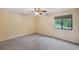 Spacious bedroom with ceiling fan and window at 655 Appaloosa Rd, Tarpon Springs, FL 34688