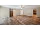 Large bedroom with wood-look flooring and barn door at 655 Appaloosa Rd, Tarpon Springs, FL 34688