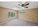 Spacious bedroom with ceiling fan and skylight at 655 Appaloosa Rd, Tarpon Springs, FL 34688