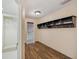 Inviting hallway with coat hooks and ample closet space at 655 Appaloosa Rd, Tarpon Springs, FL 34688