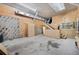 Unfinished workshop interior with concrete floor, cabinets, and stairs to upper level at 655 Appaloosa Rd, Tarpon Springs, FL 34688