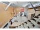 Workshop with wooden walls, concrete floor, and stairs to upper level at 655 Appaloosa Rd, Tarpon Springs, FL 34688