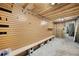 Workshop interior featuring slatted wood walls and built-in storage at 655 Appaloosa Rd, Tarpon Springs, FL 34688