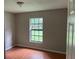 Bright bedroom with tile floors and large window at 8602 Stoner Rd, Riverview, FL 33569