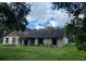 Ranch style home with mature landscaping at 8602 Stoner Rd, Riverview, FL 33569