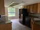 Kitchen with granite countertops and wood cabinets at 8602 Stoner Rd, Riverview, FL 33569