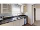 Updated kitchen, featuring white cabinets and granite countertops at 5900 5Th N Ave # D6, St Petersburg, FL 33710