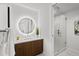 Beautiful bathroom with a modern vanity, illuminated mirror, and glass-enclosed shower with stylish tile work at 777 3Rd N Ave # 1504, St Petersburg, FL 33701