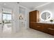 Modern bathroom with wood vanity, sleek fixtures, and a minimalist design, offering a spa-like experience at 777 3Rd N Ave # 1504, St Petersburg, FL 33701