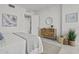 Minimalist bedroom featuring a cozy bed, stylish dresser, and natural accents, promoting a peaceful ambiance at 777 3Rd N Ave # 1504, St Petersburg, FL 33701