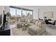 Inviting living room showcasing city views, comfortable seating, and stylish decor in this elegant home at 777 3Rd N Ave # 1504, St Petersburg, FL 33701