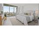 Bright and airy main bedroom with floor-to-ceiling windows offering stunning city views and ample natural light at 777 3Rd N Ave # 1504, St Petersburg, FL 33701