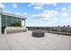 A rooftop patio featuring a fire pit, sink, and panoramic city views, ideal for entertaining guests at 777 3Rd N Ave # 1504, St Petersburg, FL 33701