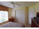 Bedroom with double bed and walk-in closet at 10131 Old Tampa Bay Dr, San Antonio, FL 33576