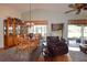 Bright dining area with wood table and leather recliner at 10131 Old Tampa Bay Dr, San Antonio, FL 33576