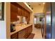Kitchen with stainless steel appliances and wood cabinets at 10131 Old Tampa Bay Dr, San Antonio, FL 33576