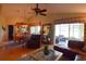 Spacious living room with leather furniture and view to backyard at 10131 Old Tampa Bay Dr, San Antonio, FL 33576