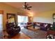 Comfortable living room with leather furniture and wood floors at 10131 Old Tampa Bay Dr, San Antonio, FL 33576