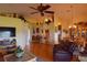 Spacious living room with hardwood floors and a view to the dining area at 10131 Old Tampa Bay Dr, San Antonio, FL 33576