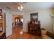 Home office with built-in shelving and view to dining room at 10131 Old Tampa Bay Dr, San Antonio, FL 33576