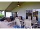 Relaxing screened porch with outdoor furniture and golf course view at 10131 Old Tampa Bay Dr, San Antonio, FL 33576